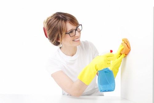 Cleaner wearing PPE during professional carpet cleaning